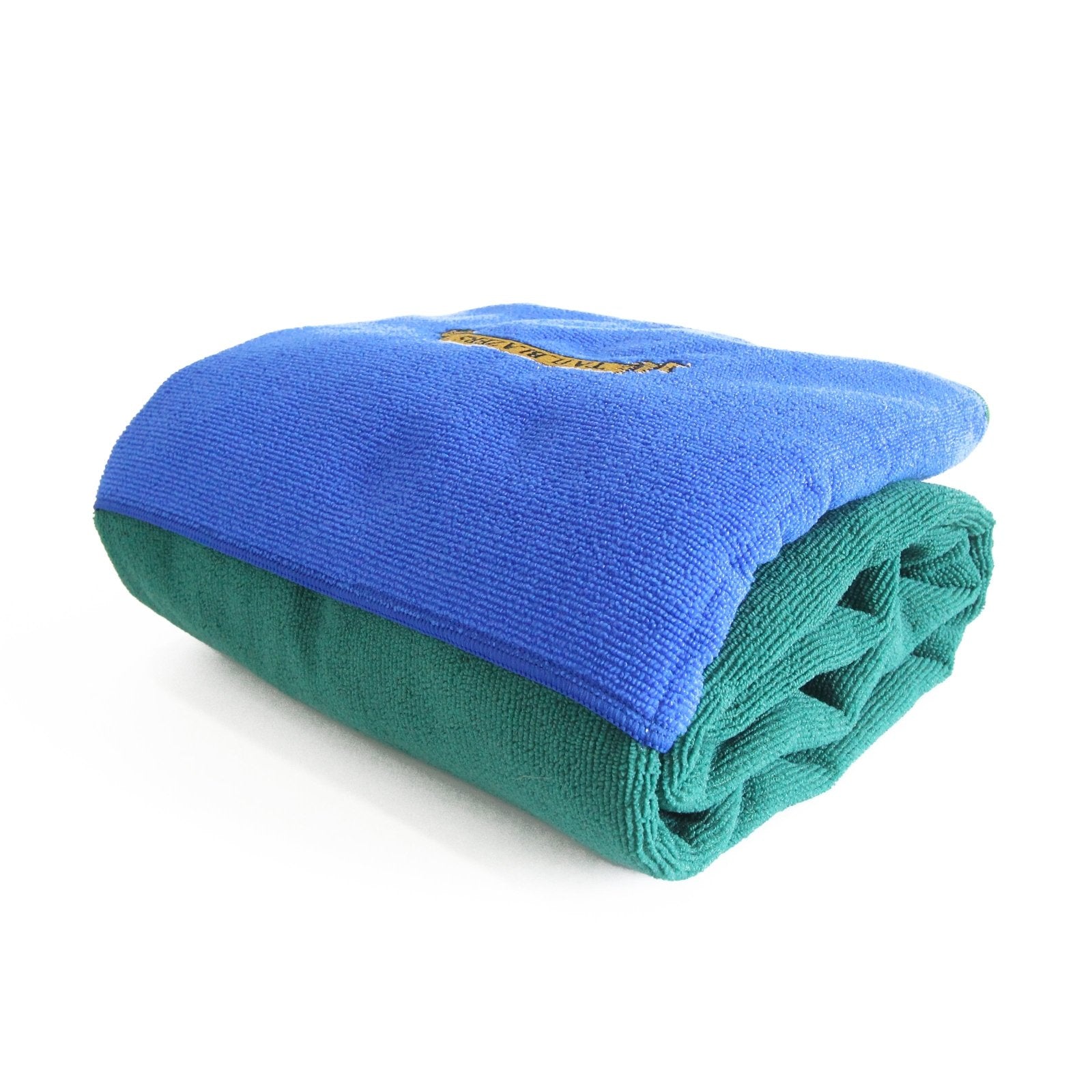 Folded microfibre towel in green and blue on white background
